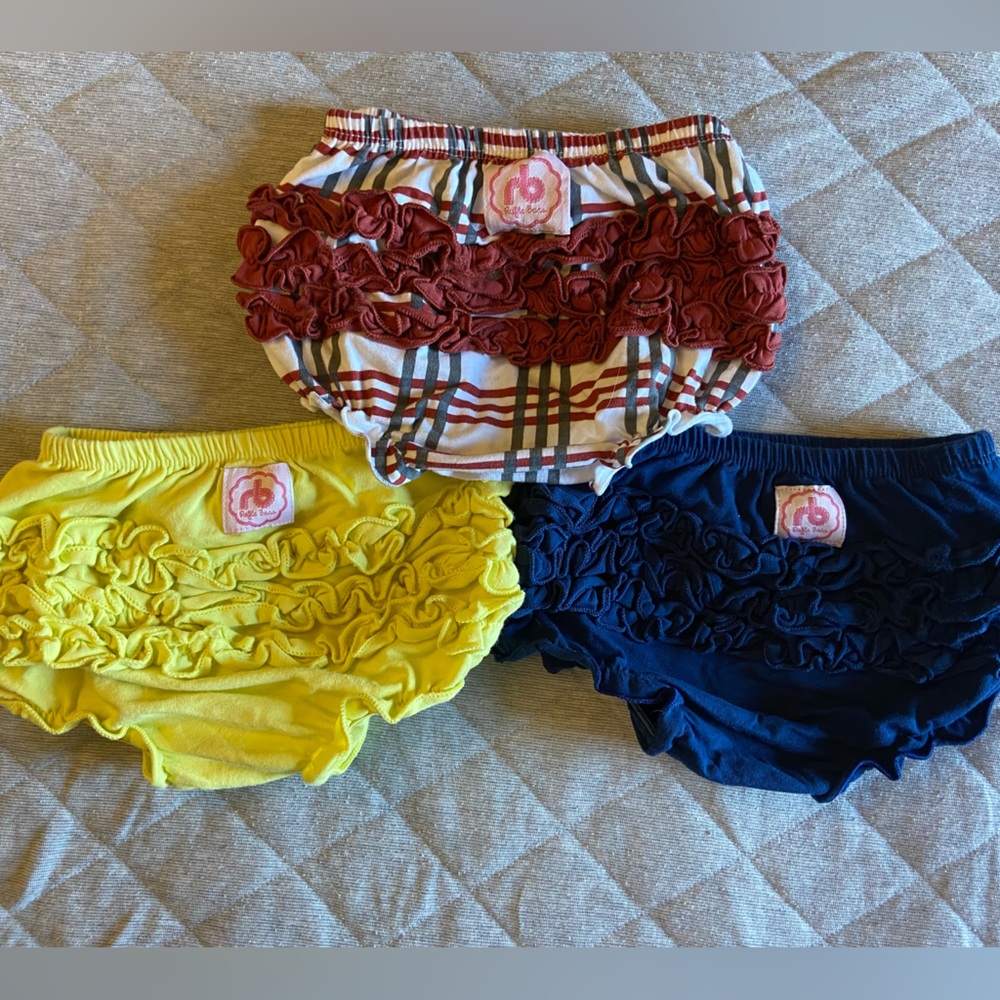 3 pairs of Ruffle Buns diaper covers and 1 pair Baby Gap crib shoes